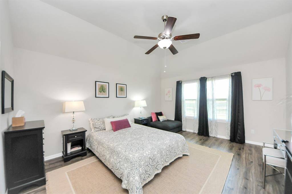 Large primary bedroom with lots of natural light