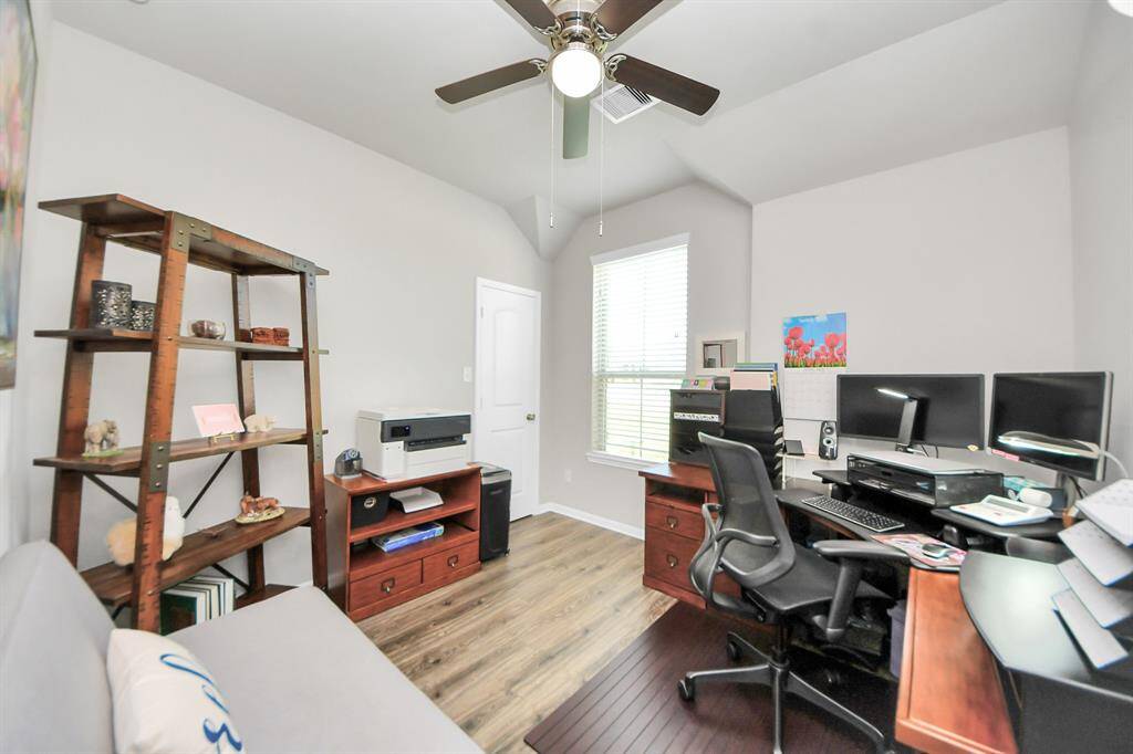 Secondary bedroom with window facing front of home.