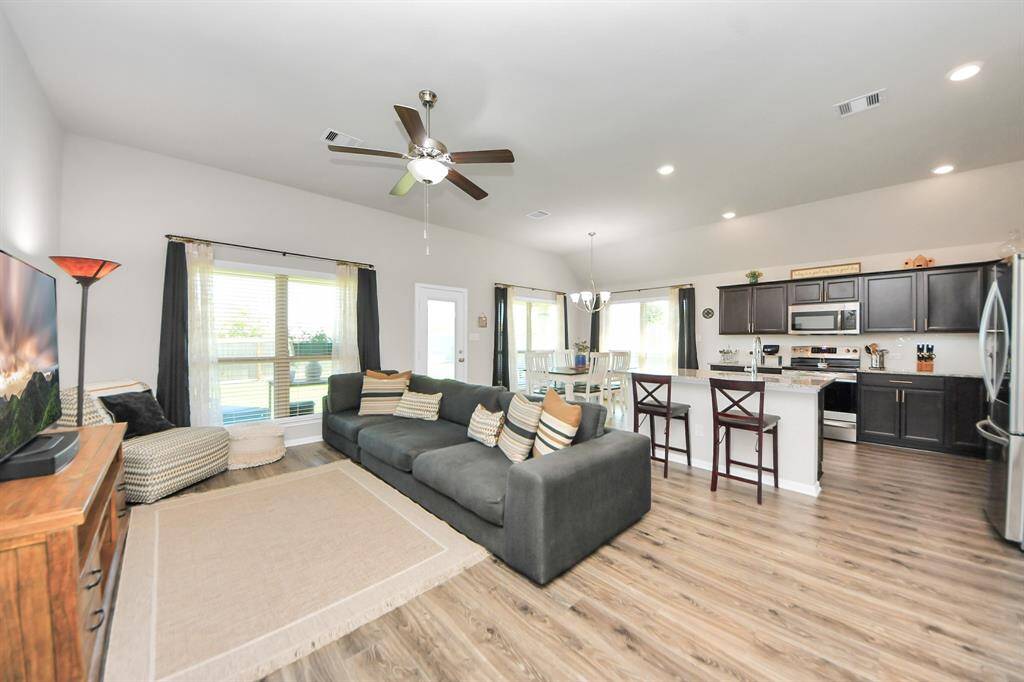 From front of home Open kitchen, living and dining.