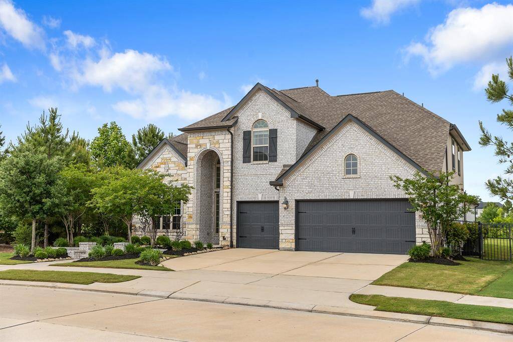 Manicured front lawns and three-car garages, exuding curb appeal with lush landscaping, neatly trimmed hedges, and a spacious driveway that complements the elegant exterior.