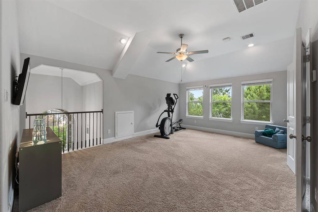 Upstairs offers generous space ideal for entertainment, relaxation, or a home gym.