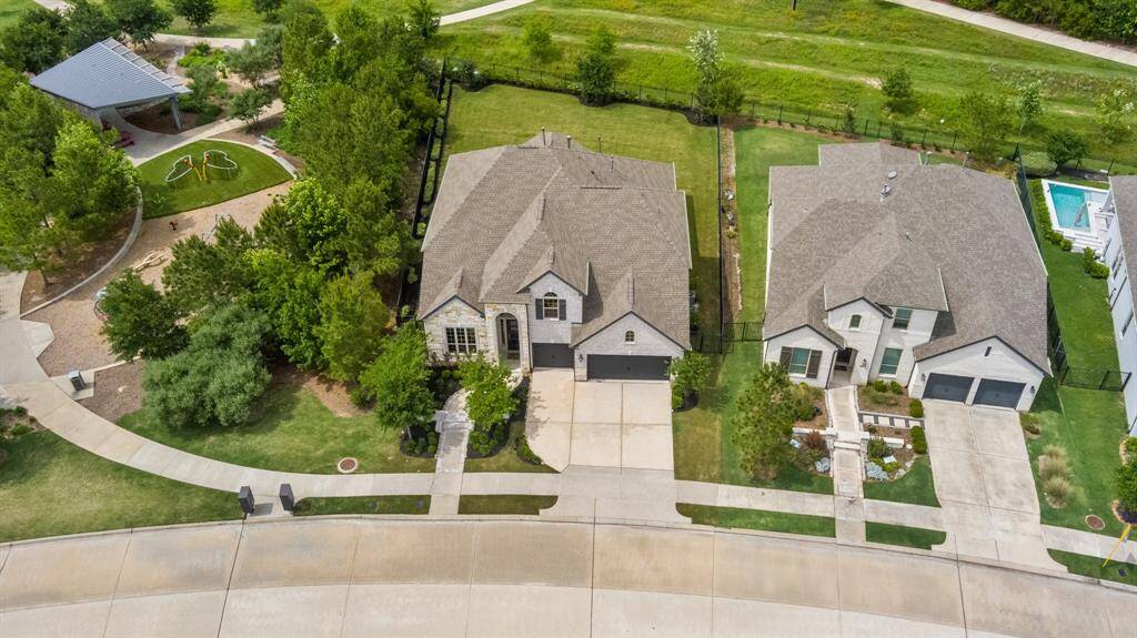 From above the property shines with its spacious lot, and meticulously landscaped front and back yard.