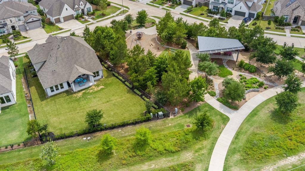 The home showcases a expansive backyard and the surrounding community is full with well-planned streets, walking trails, and nearby amenities.