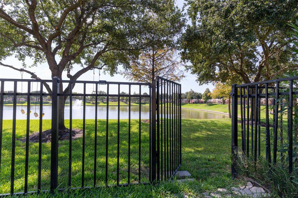 fence door to the lake
