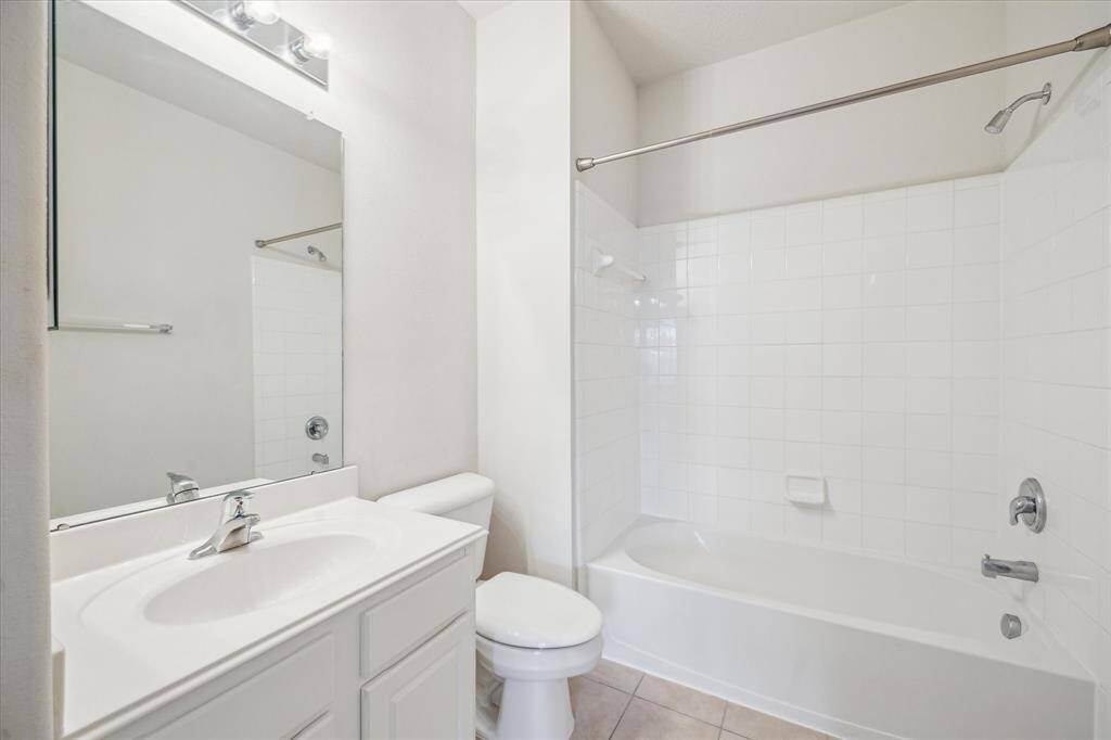 This perspective highlights both the roomy bathroom and the ample space around the bathtub.