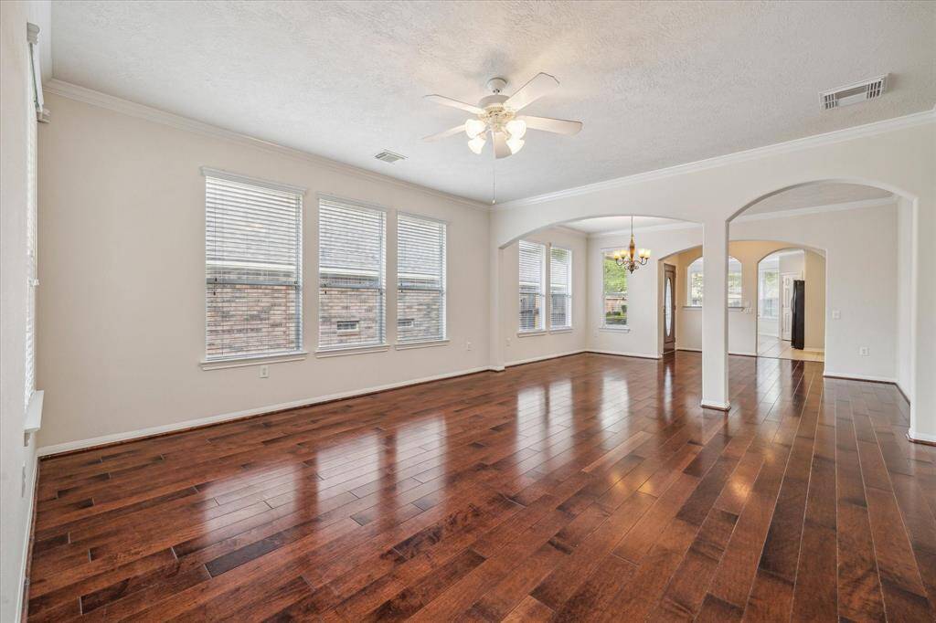You’ll love the beautiful entryway leading into the living room, featuring elegant hardwood floors and plenty of natural light, a bright and inviting space made just for you.