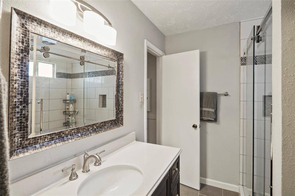 Primary bathroom has large updated walk in closet