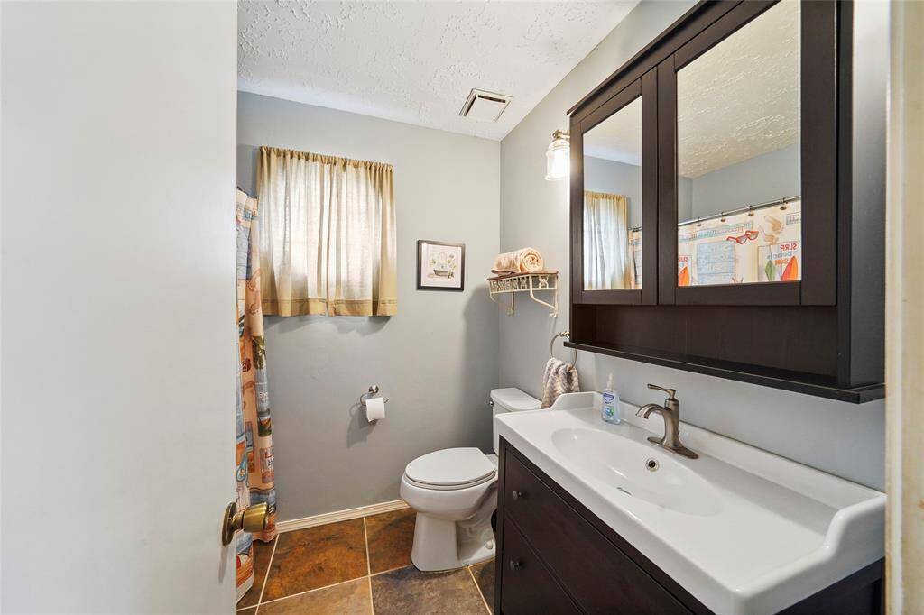 The secondary bathroom is located upstairs and has a shower/tub combo.