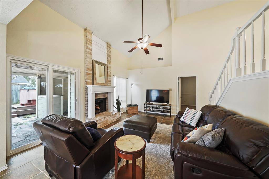 The gas log fireplace is the focal point of the living room