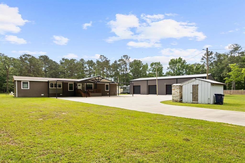 Welcome home! Multiple living spaces and a 4-car garage with workshop space.