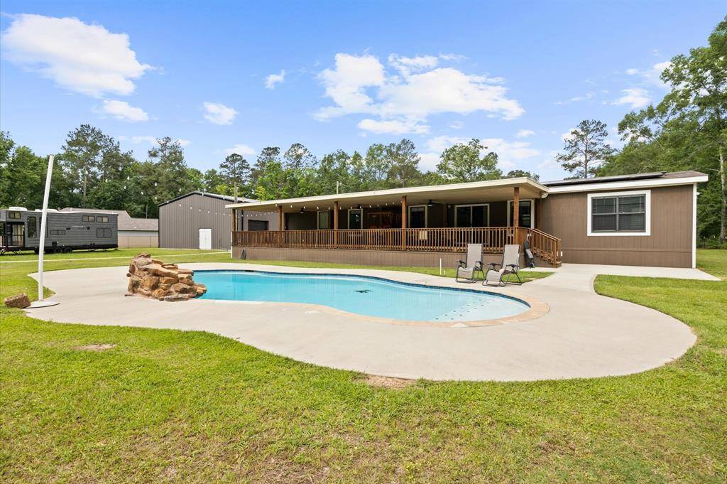 In-ground pool with spacious deck area