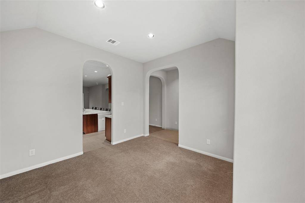 Front Dining Room, OR Office/Study OR Extra Bedroom - Yr Choice!  OPEN PLAN design, nice archways, nice views out of front of home - Visitors?    Could be a Nursery OR Gameroom  for the youngsters, where you can keep an eye on them at play - as you handle cooking and other chores. Makes a great office, away from the center of the home, yet close by. Add a screen or two OR something more permanent - again YR CHOICE!