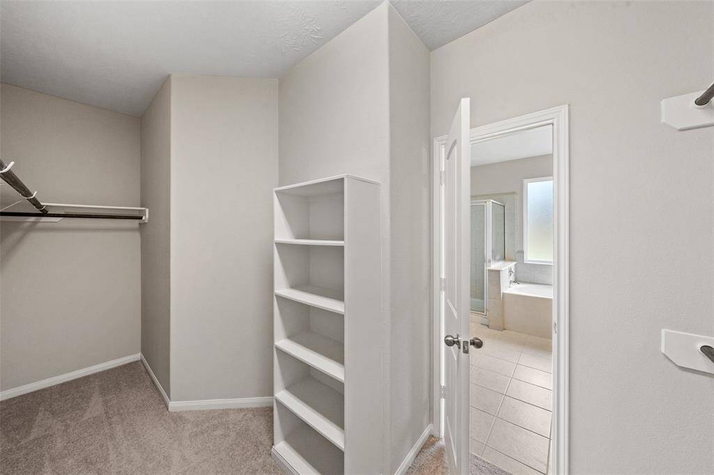 HUGE Closet well designed. right off the Primary Bedroom; at least we know where her clothes & shoes go. Yours - its up for discussion,  we are working on it!  Plenty hanging space and shelving, very efficient use of space; again, she earned it, she deserves it!