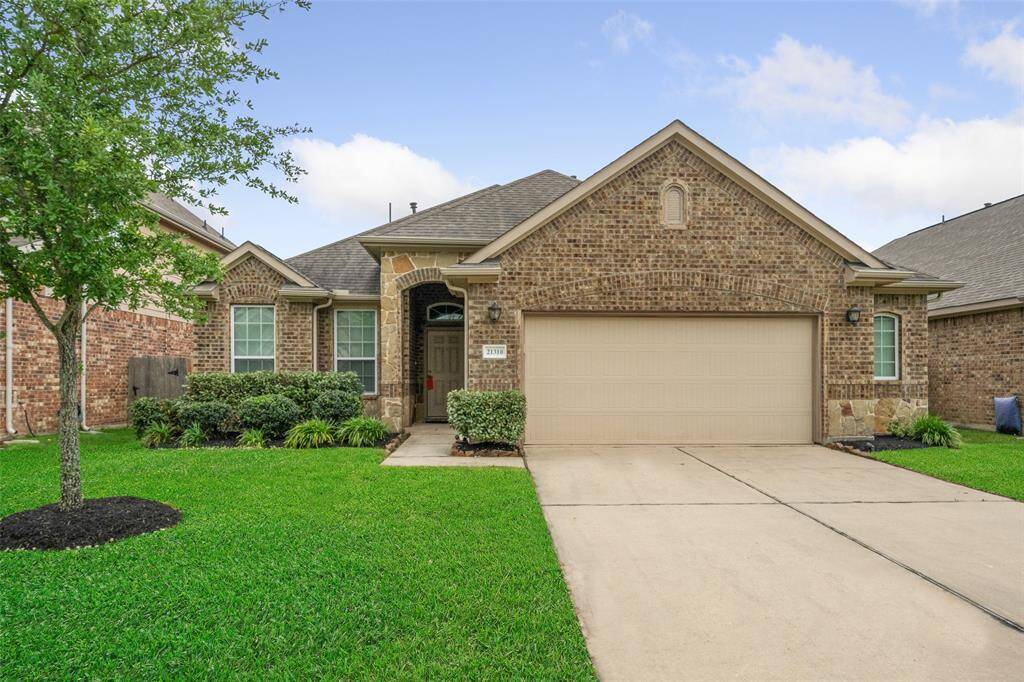 Discover this stunning 2017 semi-custom brick & stone home by LEGEND Builders, offering ~2000 sq ft of living space. The spacious garage features a sought-after 5 ft side extension, perfect for easy access. Situated on a wide lot, the property boasts ample room for children, pets, pool and outdoor activities. Enjoy the covered patio ideal for barbecues and overseeing the full auto sprinkler system. Perfect for family living and entertaining!