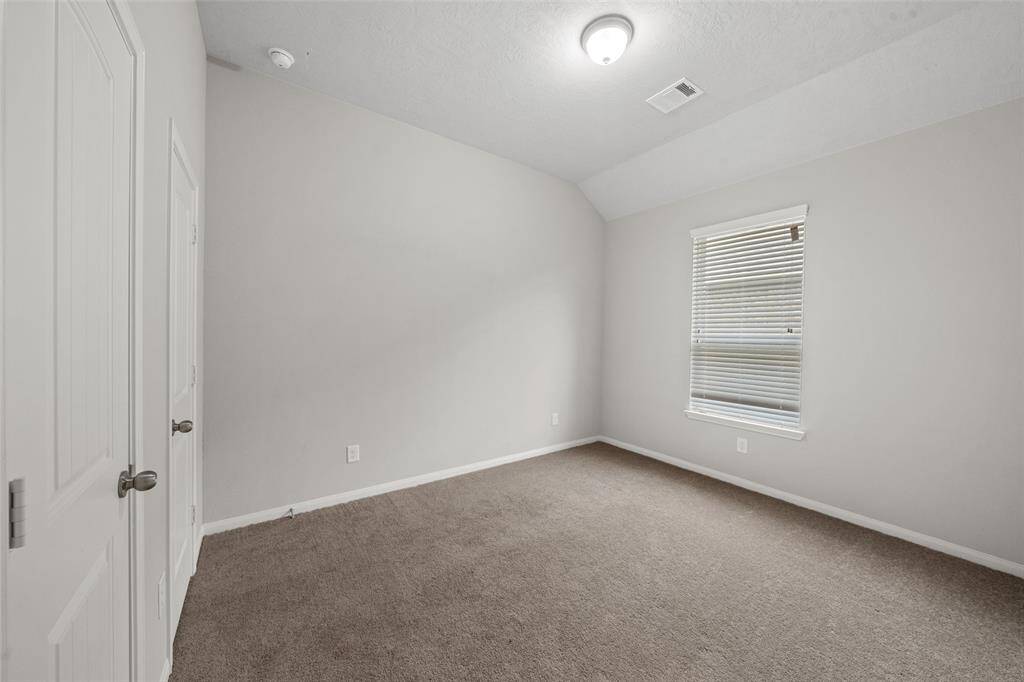 The Second Spacious Bedroom, fully carpeted, with double door hanging full length Closet space, with double entry doors, immediately adjacent to 2nd full Bathroom  AND the Utility Room is right there, just across the hallway - NICE!  Maybe, you can get yr kids to use the Washer & Dryer themselves - Miracles do happen!