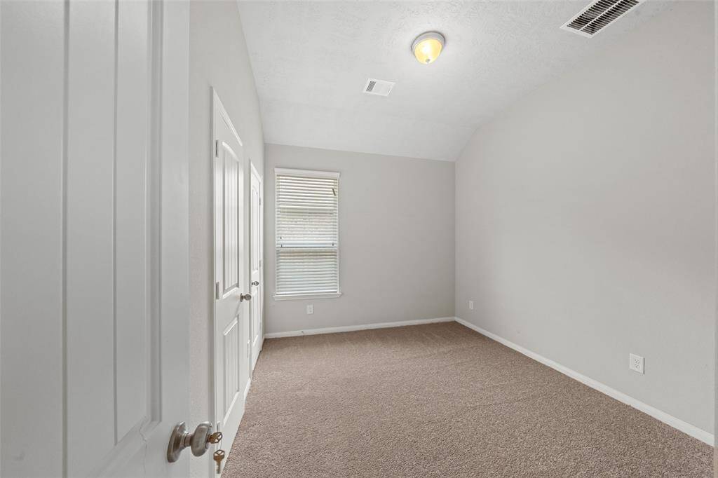 Split Plan Third full size Bedroom, with double closet all along one wall, with double door access. Right next to Bathroom & Utility Room. Both these 2 Secondary Bedrooms, are away from the Primary Bedroom, close enough to hear what is going on, but not so close, they keep you awake all night!