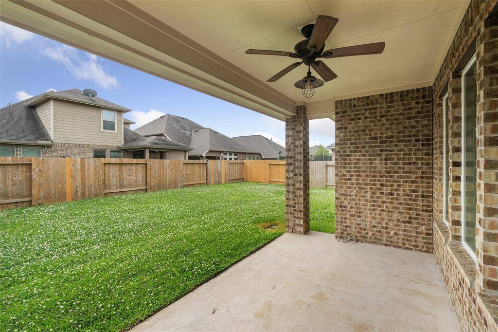Perfect Covered rear Patio/Porch, shady, sun kissed but not drenched! Center fan overhead, to cool you, all eady for the Faniuly BBQ - whose cooking?  EZ to screen in, add a tile to floor, creates a really nice additional Living Space for most of the year - NICE! Full spriklers, fence hit a little mhard in recent storms, all cleaned, washed & fully repaired!  The world here is truly Yr Oyster!!!  Plants and trees grow so fast in Texas its a REAL JOY to live here!