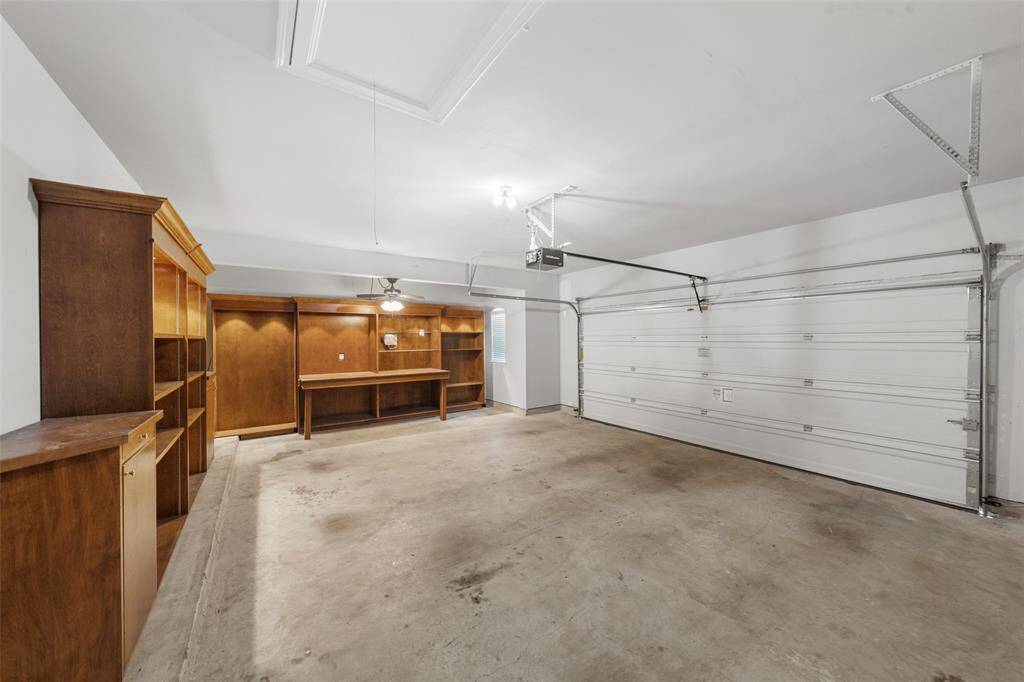 Dream Built-in Workshop in this 2.5 Car garage, with its full 5 ft wide, Side Extension, ALL DOWN full length of Garage - SO, SO USEFUL. You could run a small business from here, with its CUSTOM BUILT-IN shelving, work benches, lighting and Power - READY! READY! READY! Garage is fully sheet rocked, painted & insulated - READY FOR THAT NEW CRAFTSMAN!
