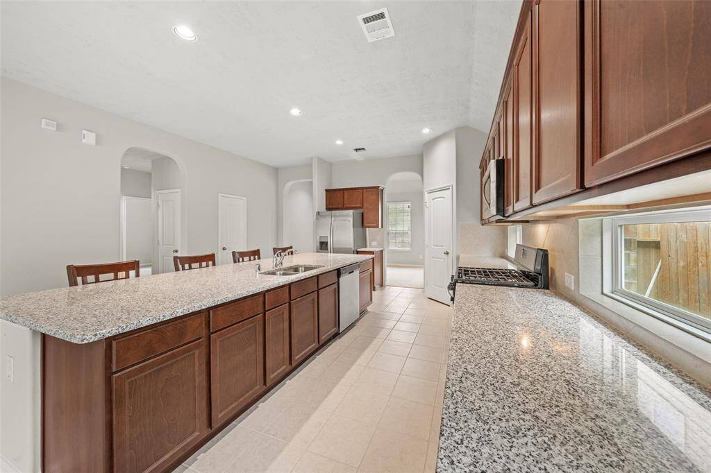Discover the chef’s kitchen featuring a charming under-counter window that floods the space with natural light, enhancing the joy of cooking. This dream home offers natural colors, a superb floor plan, and a prime location. Enjoy modern amenities and manageable utility bills.
