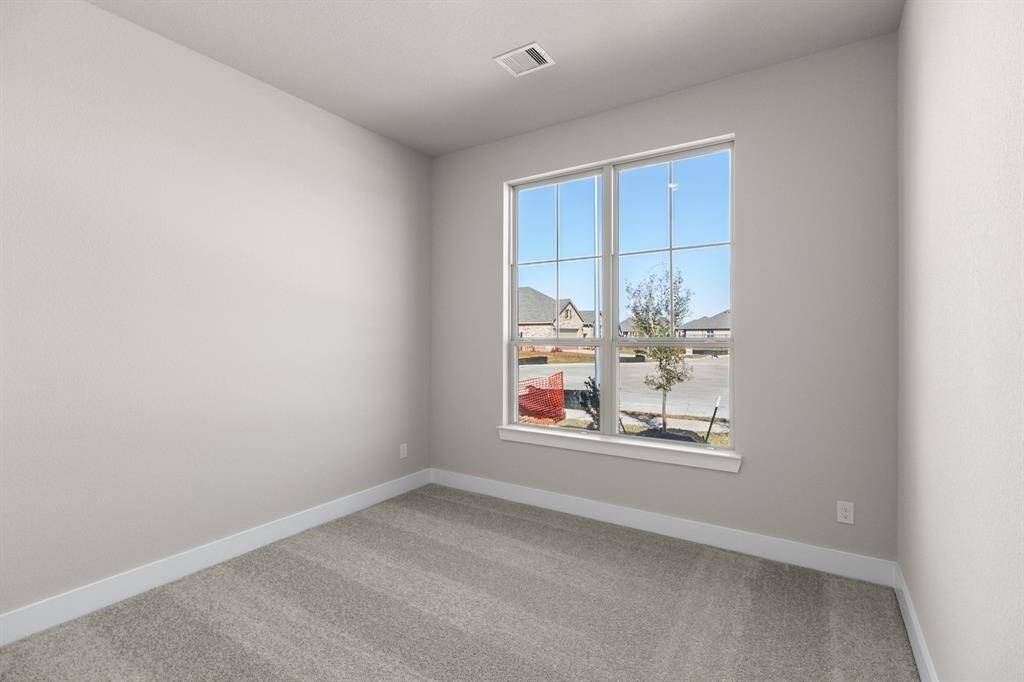 large windows for natural light, and a private full bathroom with modern fixtures. Perfect for guests or multigenerational living!