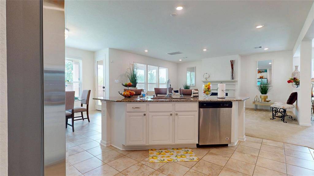 Another view of the open concept kitchen and the living room.