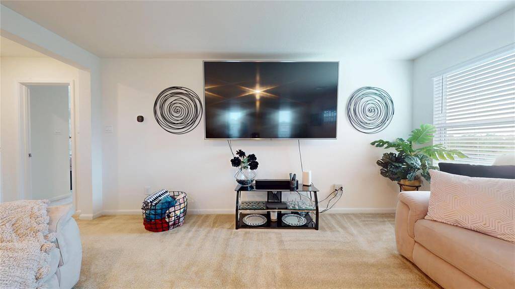 The incredible wall/floor space on this second 'game room' floor is yours to use! It has spacious carpeted flooring and ample natural light.