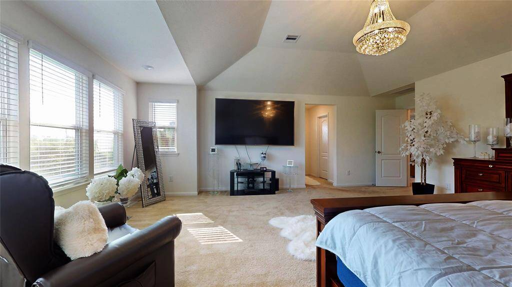 Sizeable pieces are welcomed in your primary retreat of peace and repose; with your ensuite bathroom peeking out, up center.