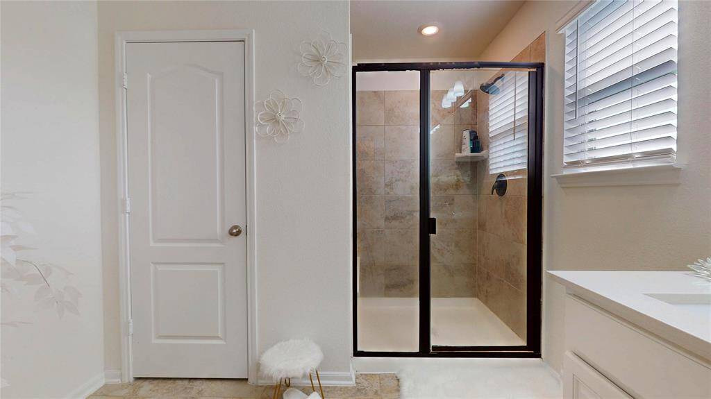 Primary bedroom large refreshing shower.