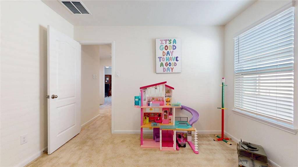This third bedroom gets great natural light and easily accesses hallways.
