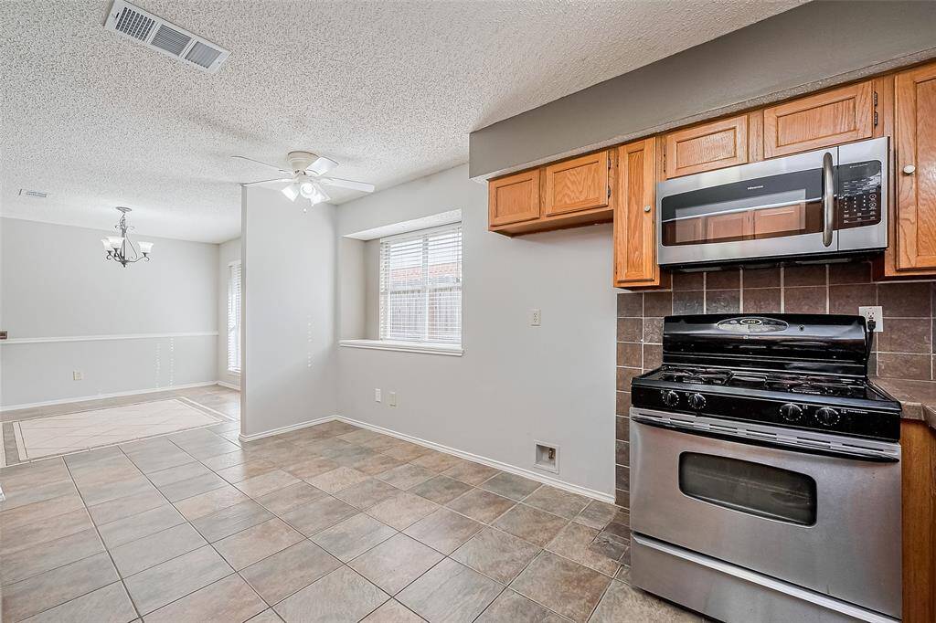 Breakfast area or flex space....you choose. The perfect spot for a table, desk, extra storage, movable island, etc. And the window has a shelf large enough for plants or display items.