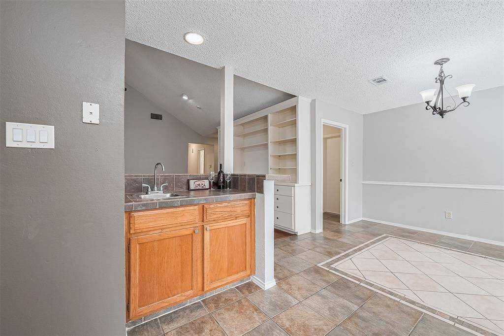 Practice your mixology skills or use the wet bar as an extra prep space between the kitchen and dining room.