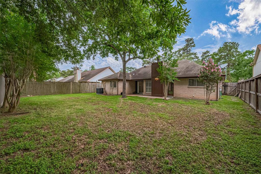 Enjoy relaxing or entertaining in your fully-fenced, generously-sized backyard. Mature trees add to its peaceful beauty.