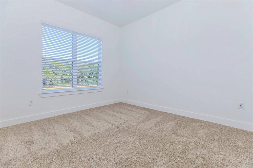 Spacious bedroom with large window