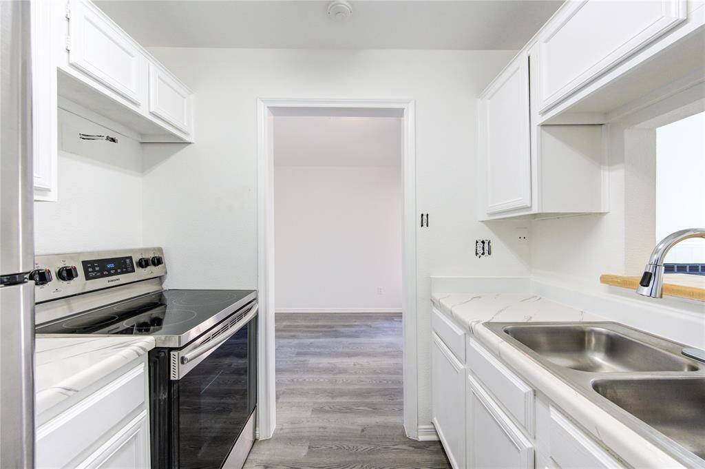 Freshly painted white cabinetry enhances the sense of space while offering plenty of storage. Stainless steel appliances add a modern touch, creating a kitchen that’s both stylish and practical. Designed for everything from casual mornings to gourmet meals. Contact me today for details or a tour.