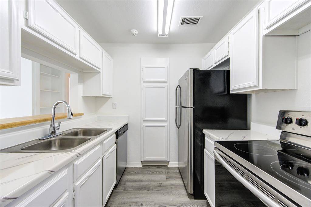 This freshly painted white kitchen offers a clean, timeless look that feels both inviting and sophisticated. The crisp white cabinetry enhances the sense of space and light, while stainless steel appliances add a sleek, modern touch. Designed for both function and style, this kitchen is ready for everything from casual mornings to gourmet meals. Contact me today for more details or to schedule a tour.