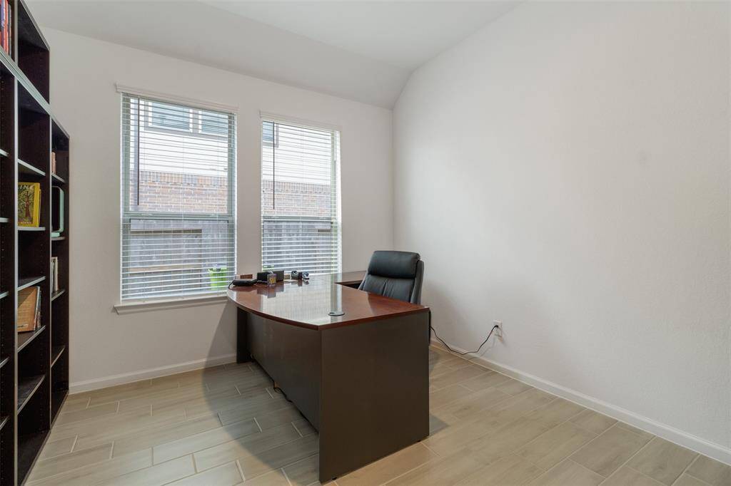 Your spacious home office is ready for you to work.