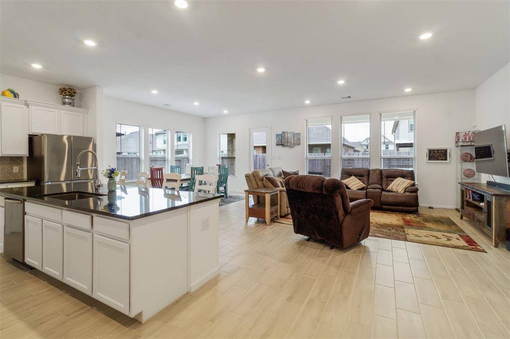 The windows are plentiful in this living/dining room space.