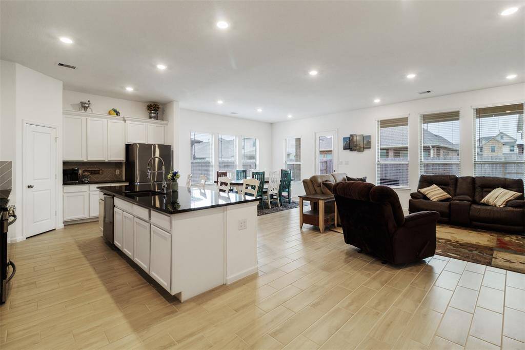 With an Island this size and open to the living room, you could host all of your family gatherings.