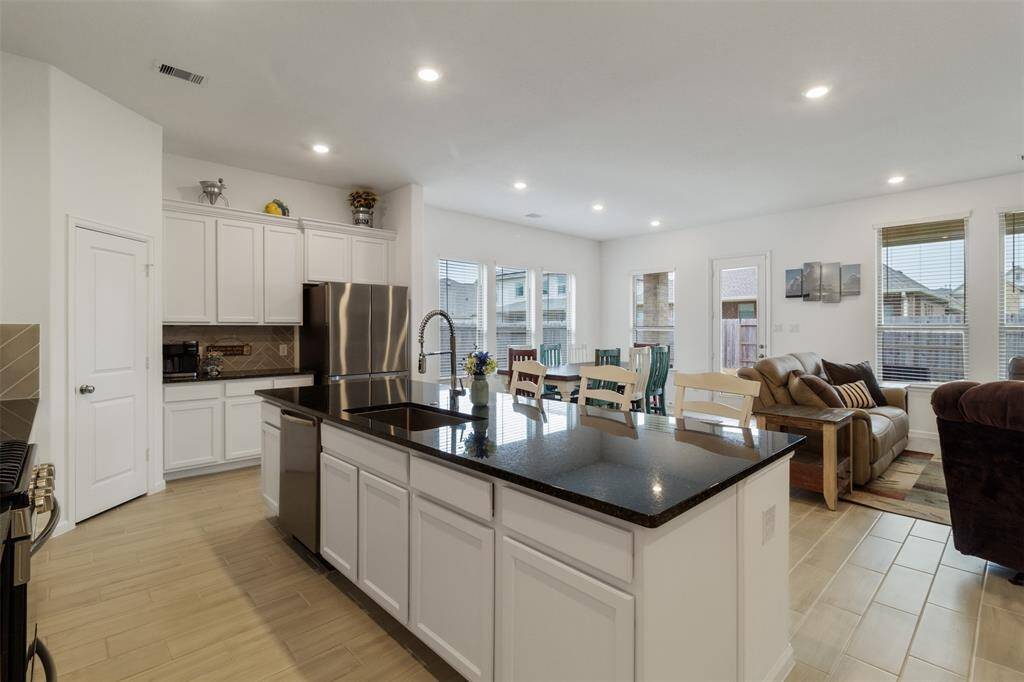 The farmhouse sink is a great feature in this large kitchen.