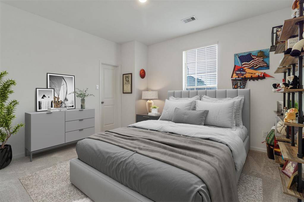 This virtually staged bedroom is just off the entry way.