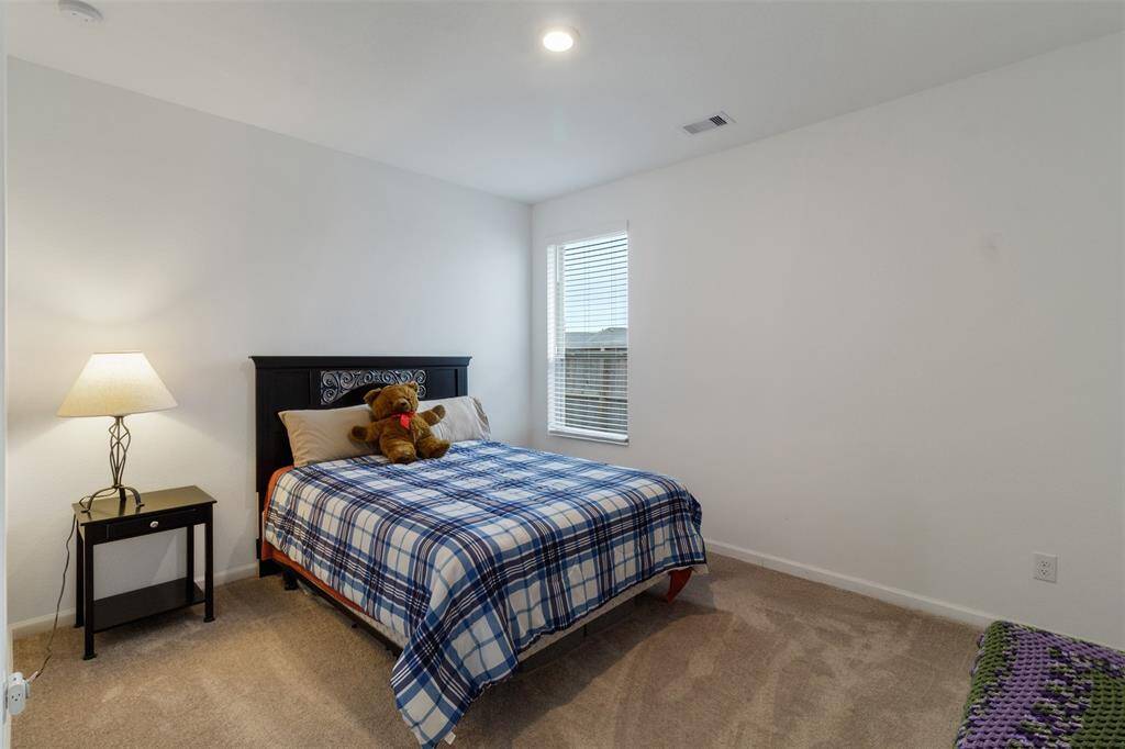 The Secondary bedroom right outside of the hallway bathroom.