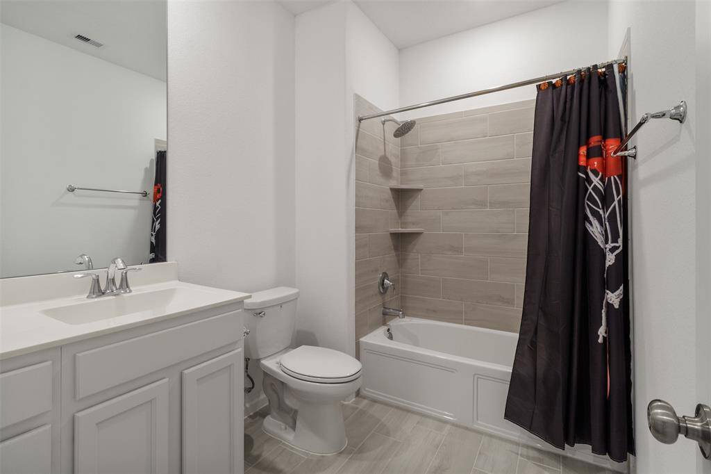 The hall bath is positioned just outside of the front two bedrooms.