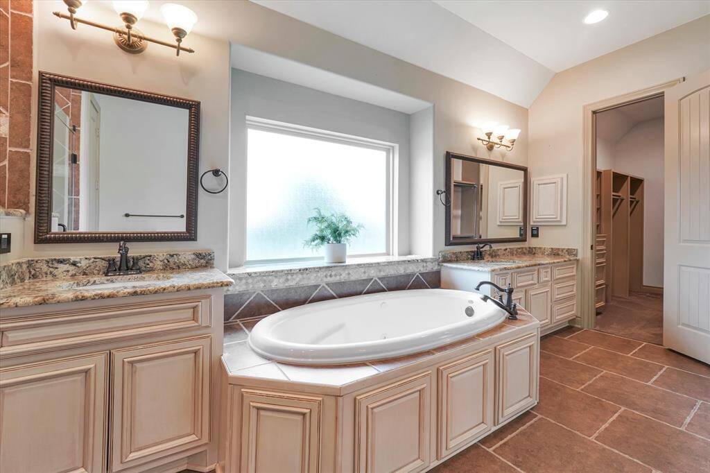 Indulge in ultimate relaxation with a spacious, elegant soaking tub.
