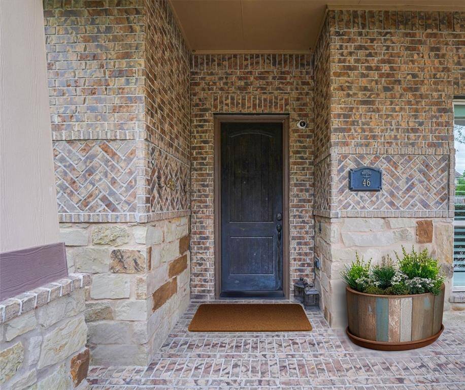 Charming covered front patio, perfect for relaxing and welcoming guests.