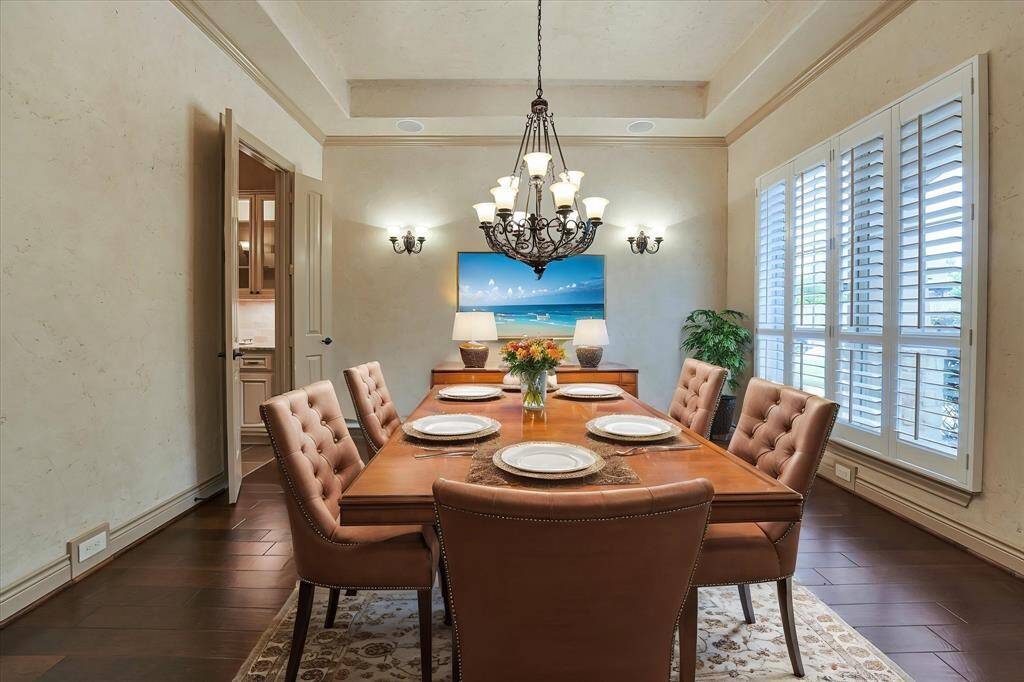 Elegant formal dining room featuring plantation blinds
