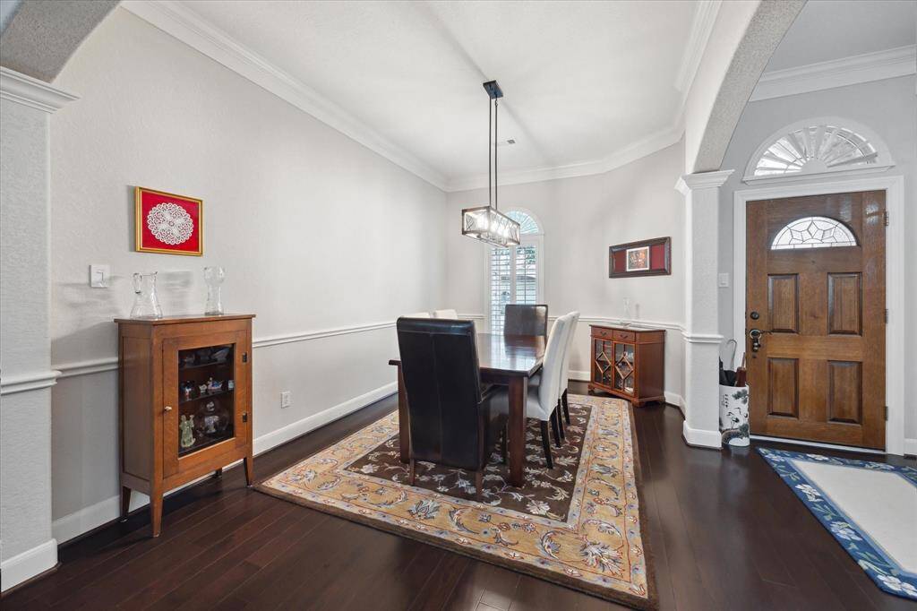 Looking toward the front door, a spacious dining room sits just to the left of the entry to the home.