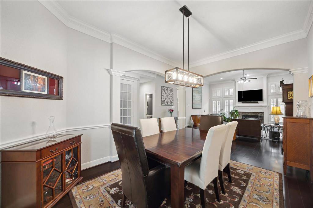 The dining room has plenty of space for an even bigger table along with complimentary sideboards, and it flows seamlessly into the living room.