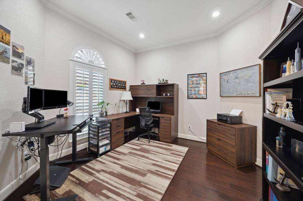 Across the entry hall from the dining room is the home office with a window looking toward the front yard and street.