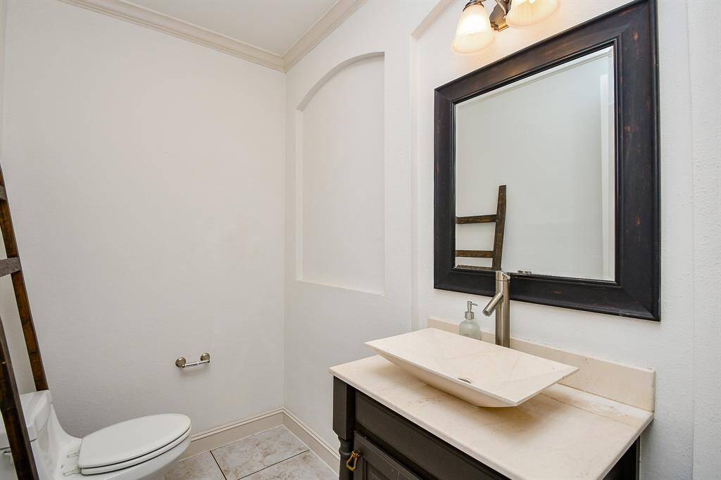 Large powder room on first floor just off the formal dining room
