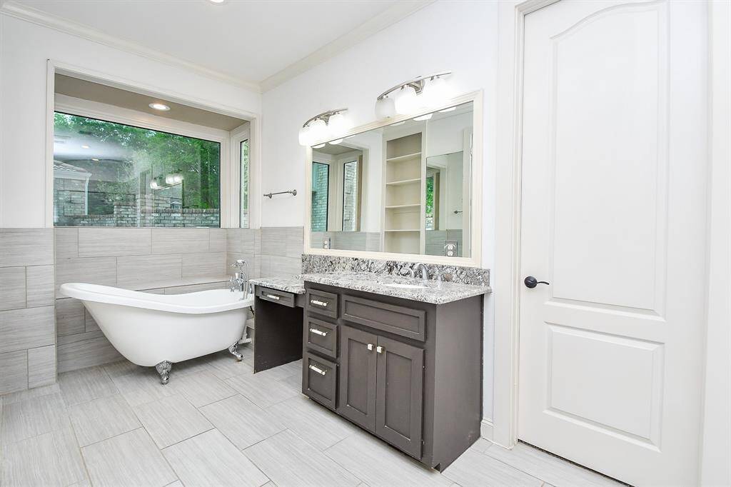 Clawfoot tub in primary offers a space to unwind after a long day